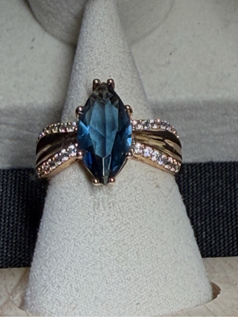4 CTW sapphire centered in 18k rose gold triple plate with side stones. SZ 10